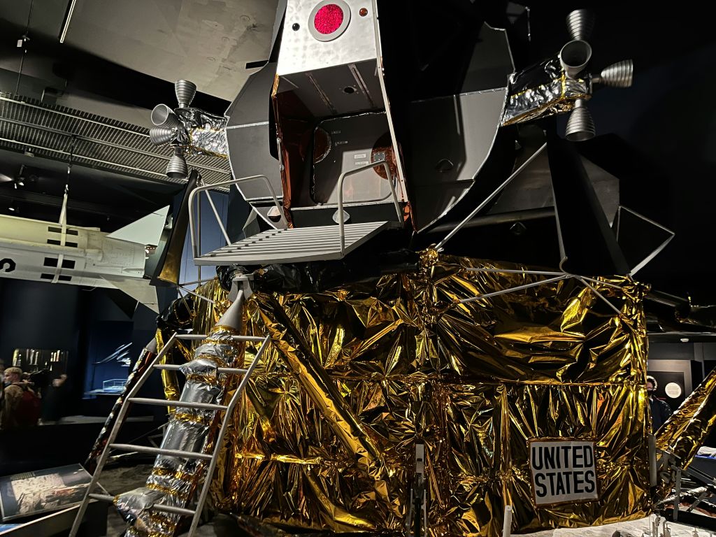 Museum visitor looking at a space exhibit